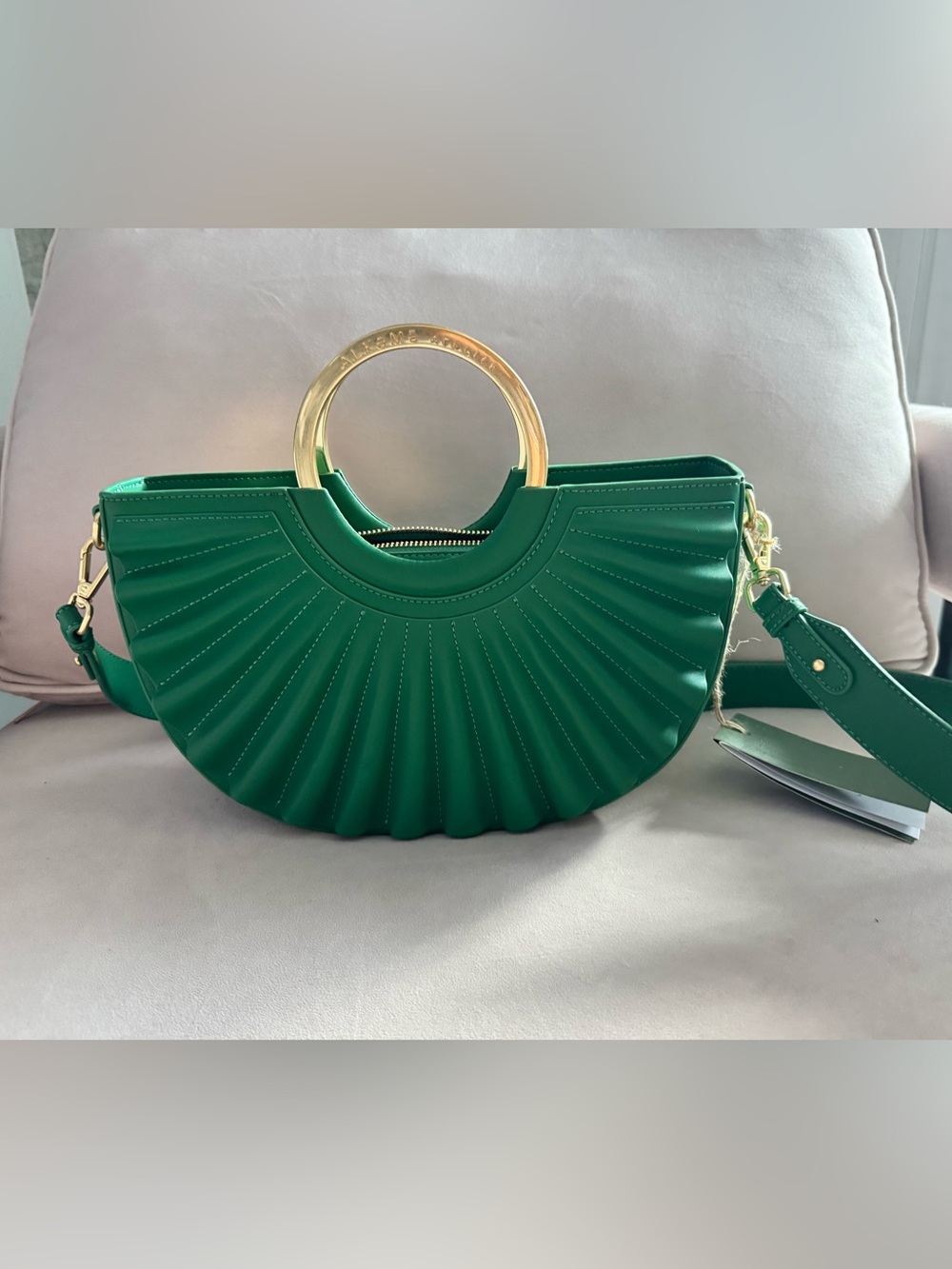 Alkeme Atelier Water Moon Bag features a distinct pleated emerald green